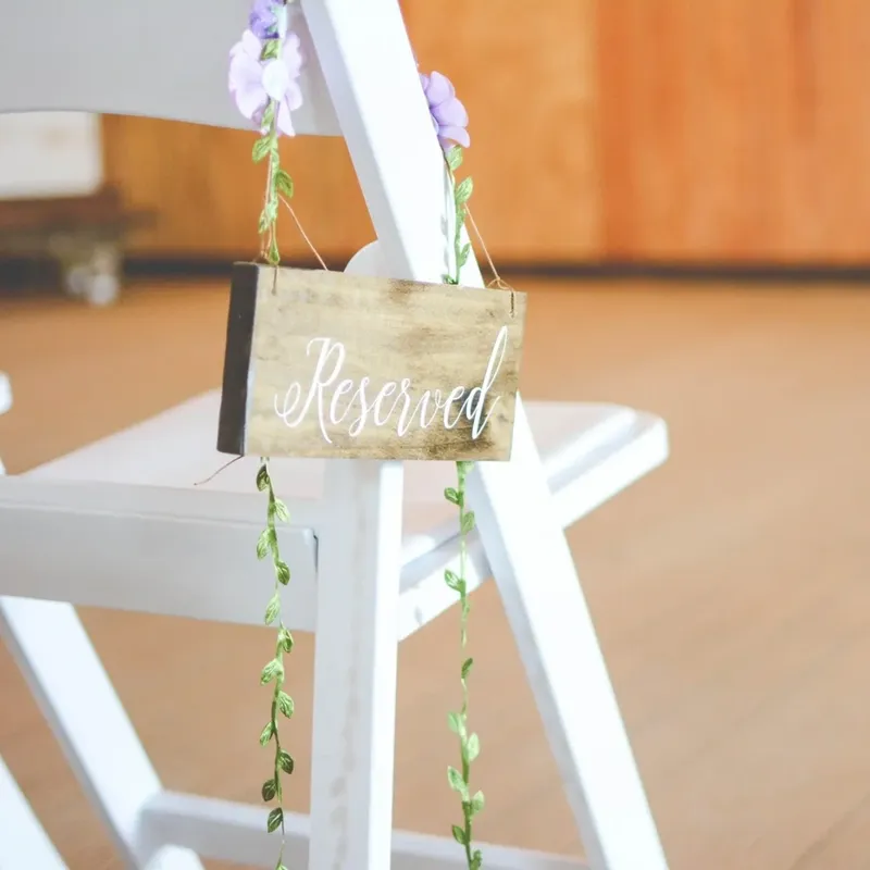 wedding table chair reservation sign